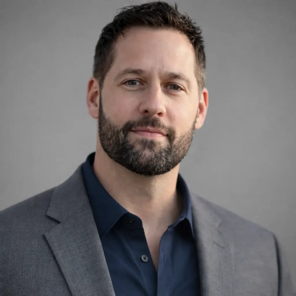 Bearded man wearing suit jacket and shirt